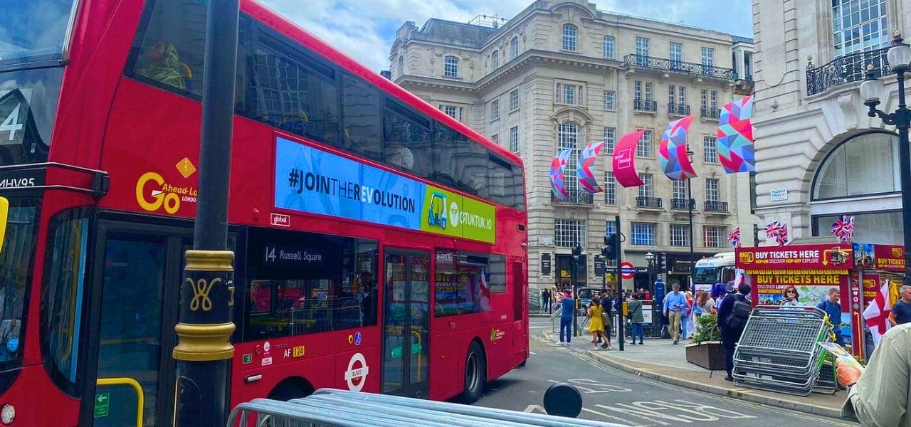 eTukTuk poster on the side of a London bus